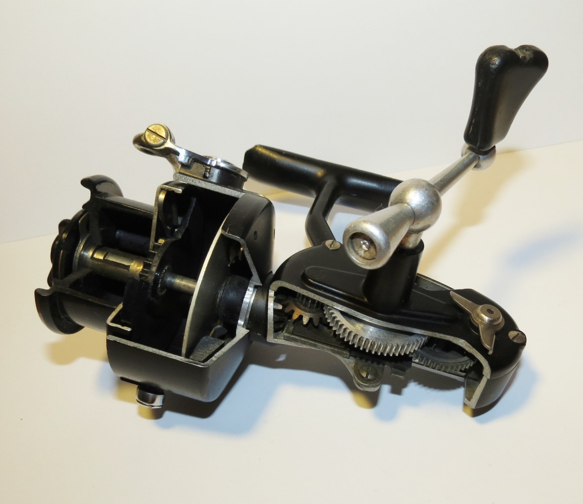 A Vintage Early Half Bale Arm Mitchell Spinning Reel (300 Shape)